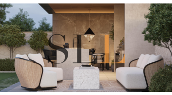 Créer un coin lounge extérieur design avec du mobilier et un lampadaire élégant